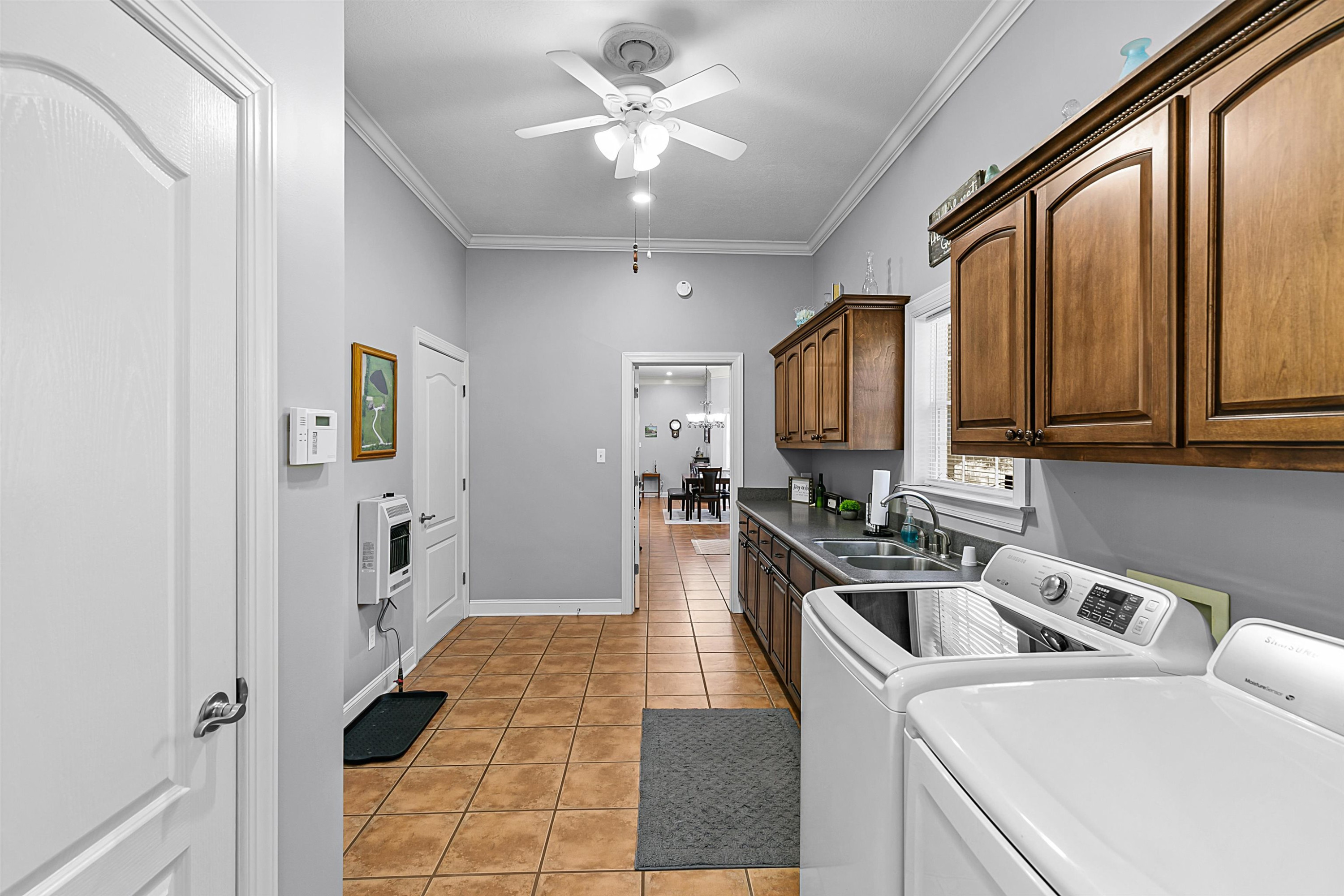 400 Hughes Road East Jackson, TN 38305 - Photo 14 of 36 a view of a kitchen with a sink washer and dryer