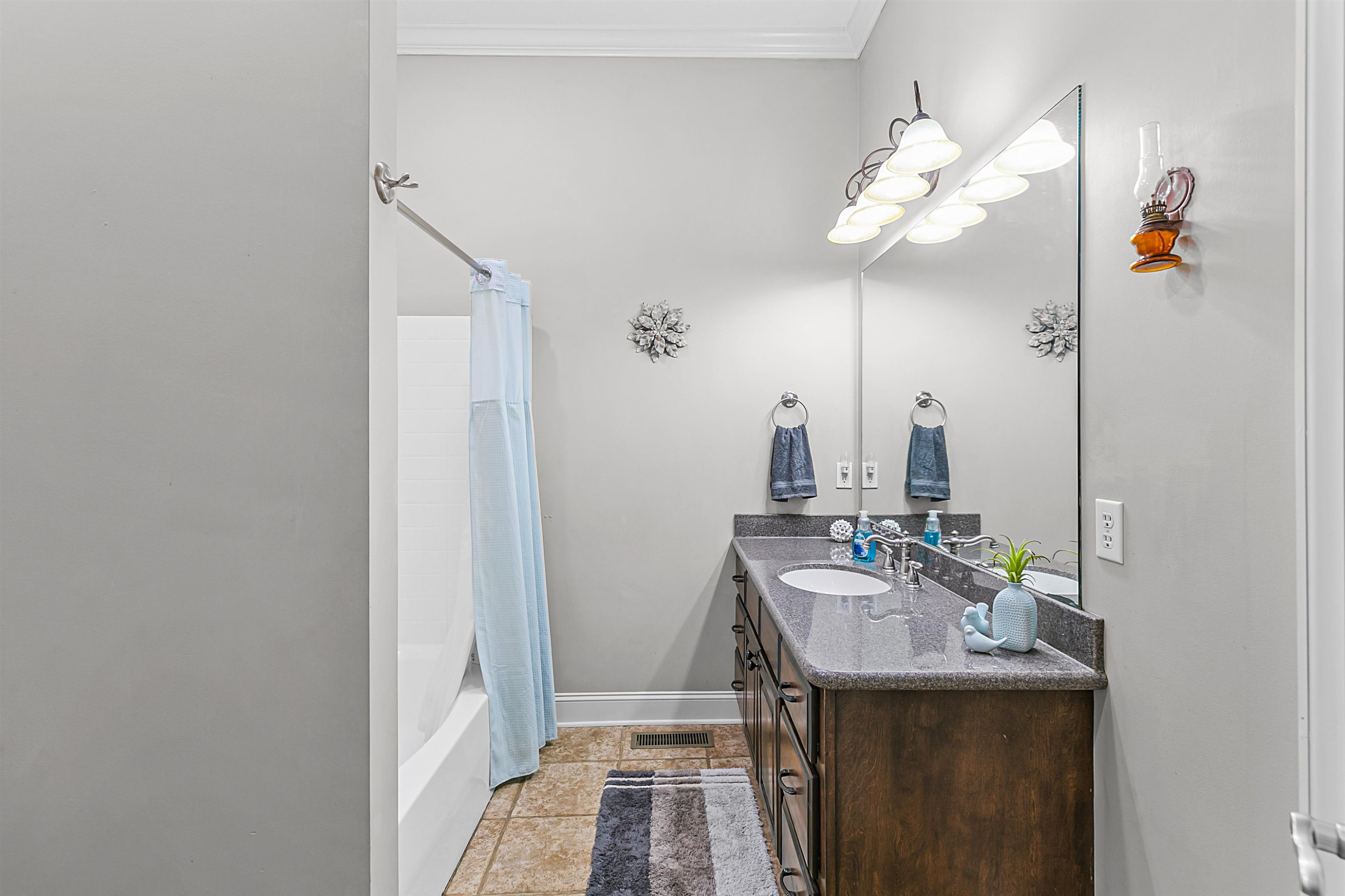 400 Hughes Road East Jackson, TN 38305 - Photo 18 of 36 a bathroom with a sink a mirror and vanity