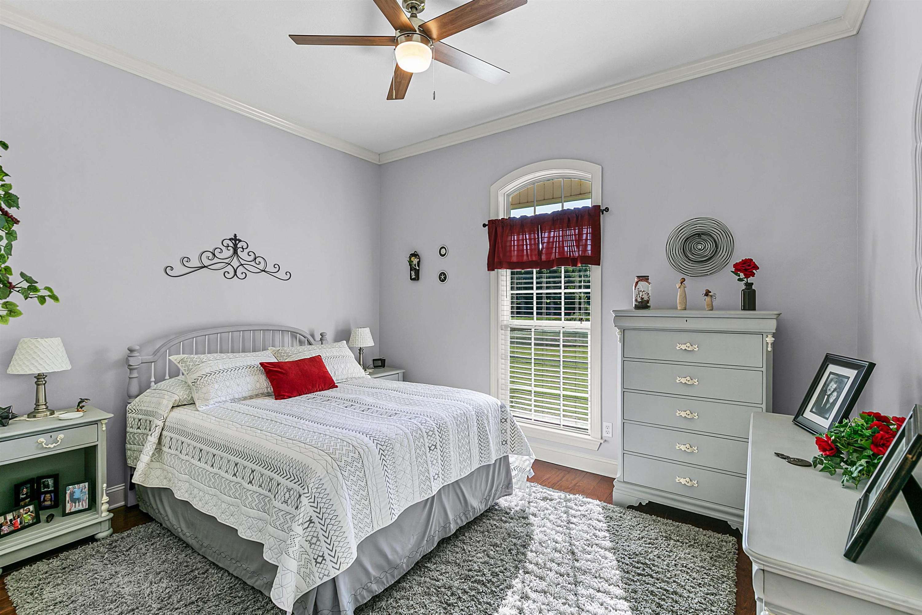 400 Hughes Road East Jackson, TN 38305 - Photo 19 of 36 a bedroom with a bed and a dresser