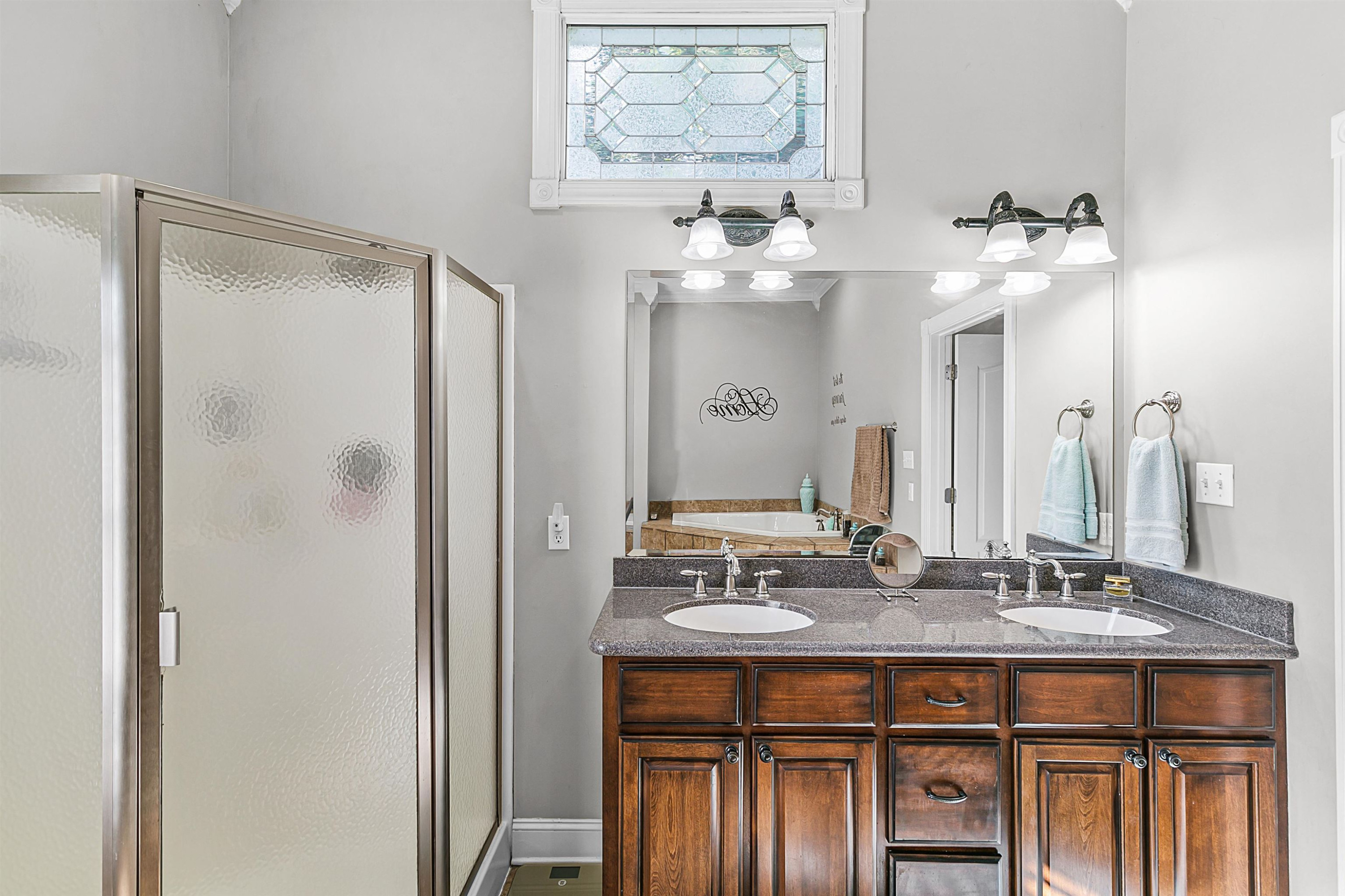 400 Hughes Road East Jackson, TN 38305 - Photo 24 of 36 a bathroom with a double vanity sink and a mirror
