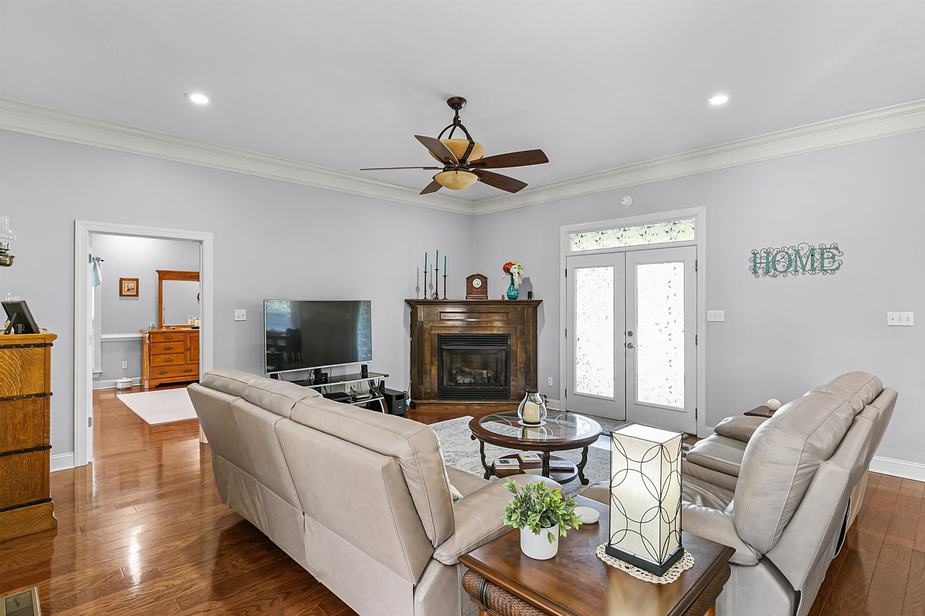 400 Hughes Road East Jackson, TN 38305 - Photo 30 of 36 a living room with furniture a fireplace and a flat screen tv