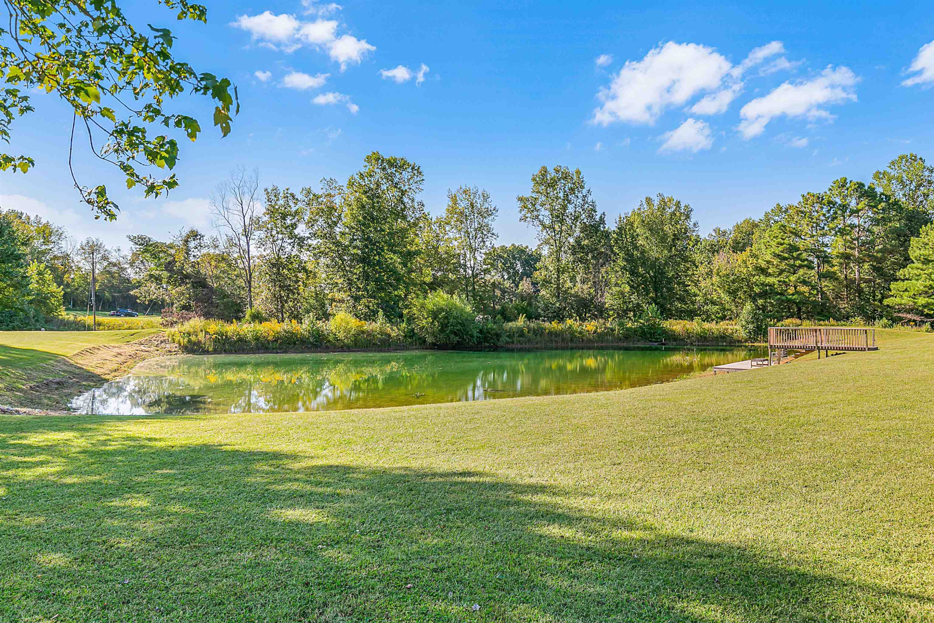 400 Hughes Road East Jackson, TN 38305 - Photo 3 of 36 a view of a lake with a big yard