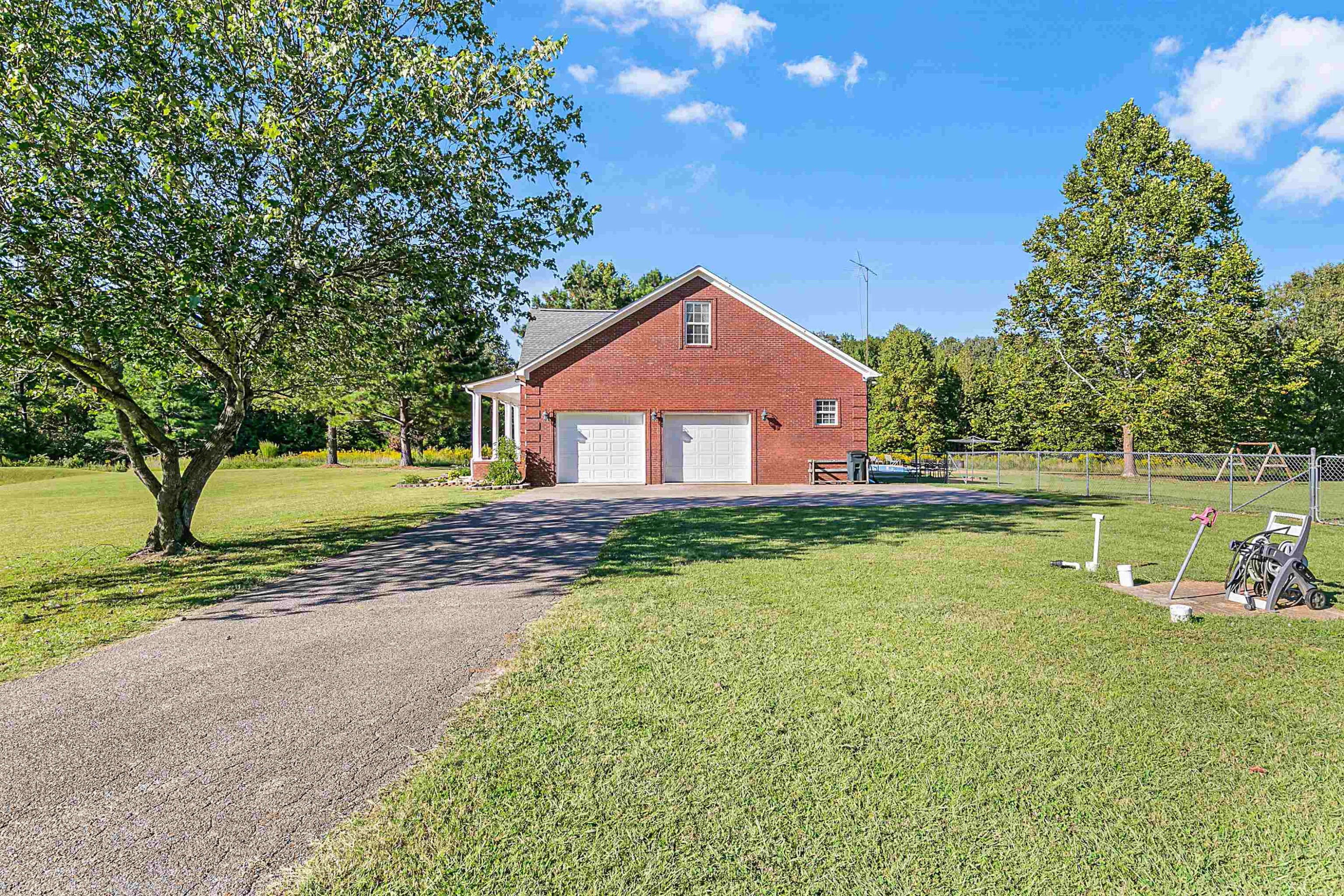 400 Hughes Road East Jackson, TN 38305 - Photo 7 of 36 a front view of a house with a yard