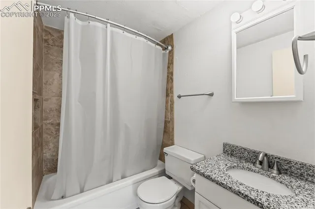 a view of an empty room and a window