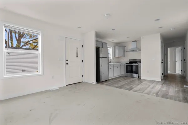 a view of a kitchen with a stove cabinets and a wooden floor