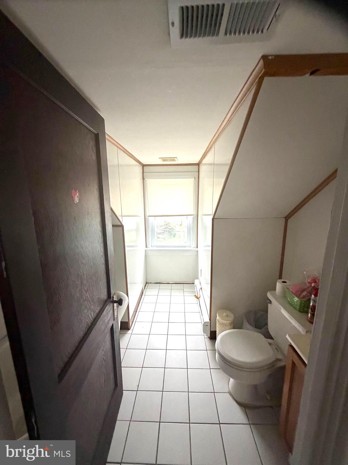 463 Burmont Road Drexel Hill, PA 19026 - Photo 27 of 39 a bathroom with a sink a toilet a window and shower