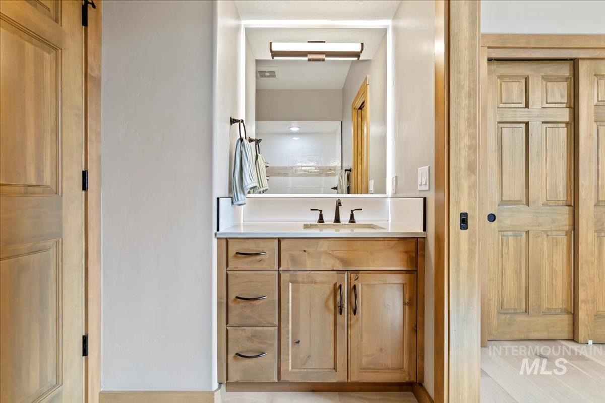 79 East Aikens Road, Unit 202 Eagle, ID 83616 - Photo 28 of 47 Bathroom featuring vanity and wood finished floors