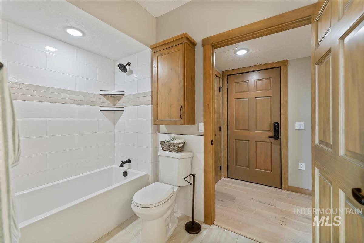 79 East Aikens Road, Unit 202 Eagle, ID 83616 - Photo 29 of 47 Bathroom with shower combination, wood finished floors, and recessed lighting