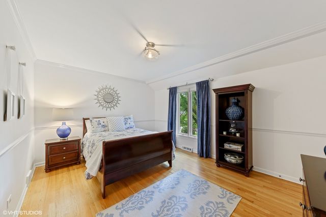 a bed room with a bed and a window