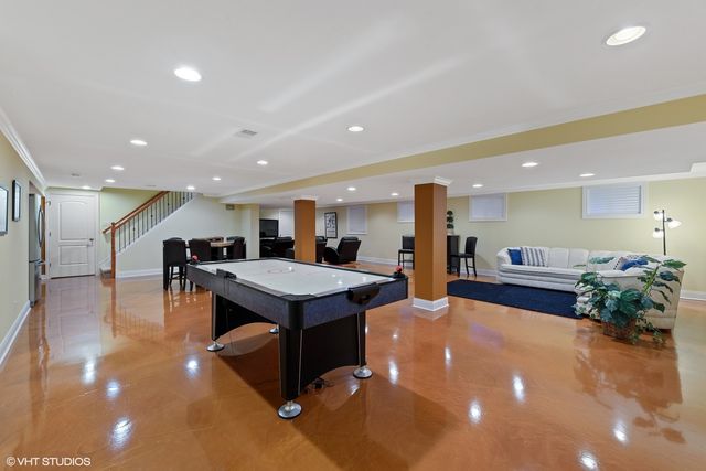 a lobby with a table and chairs in it