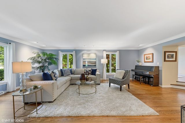 a living room with furniture and a table