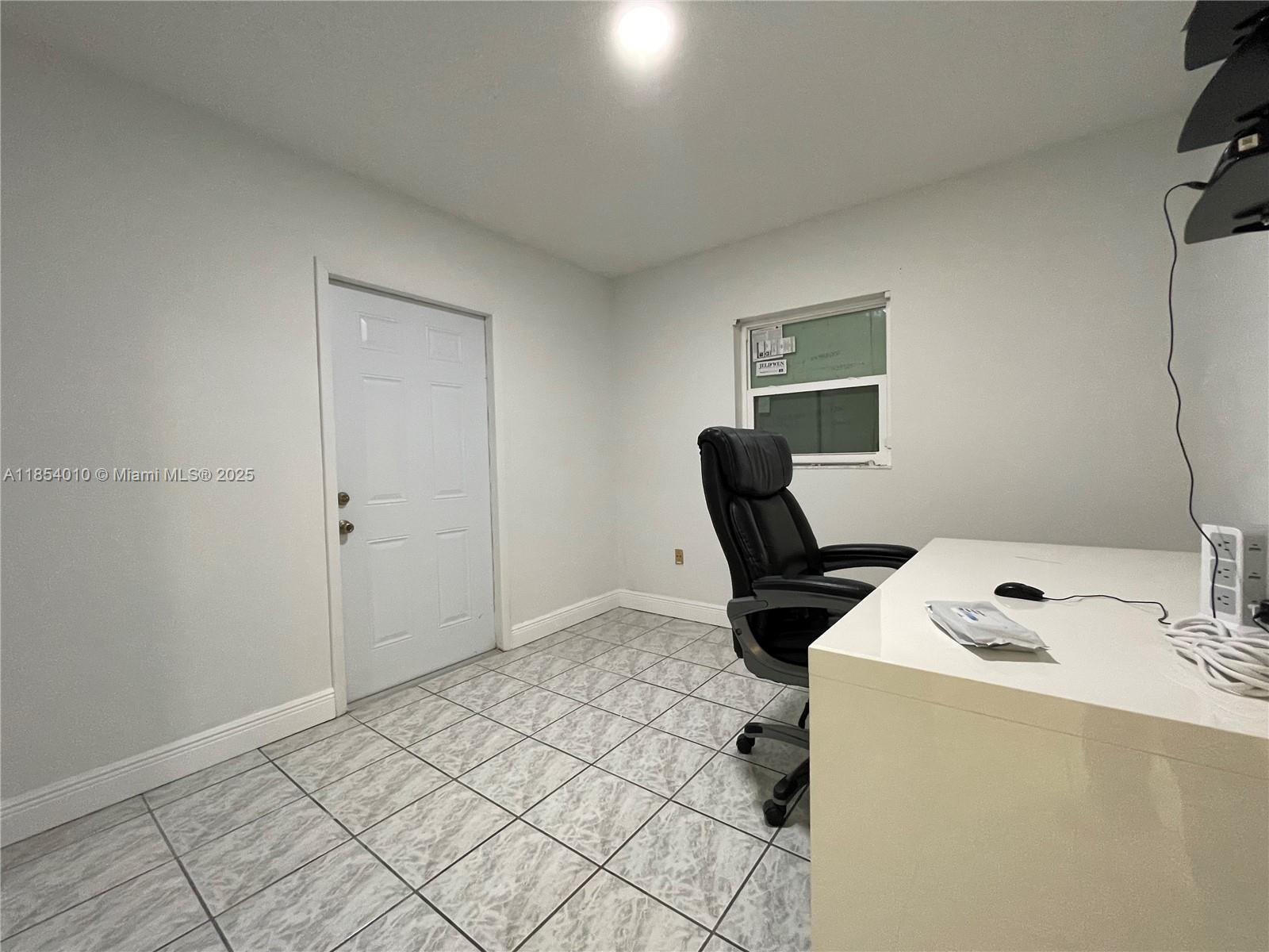 15550 Southwest 308th Street, Unit 15550 Homestead, FL 33033 - Photo 7 of 11 a view of workspace with cabinets