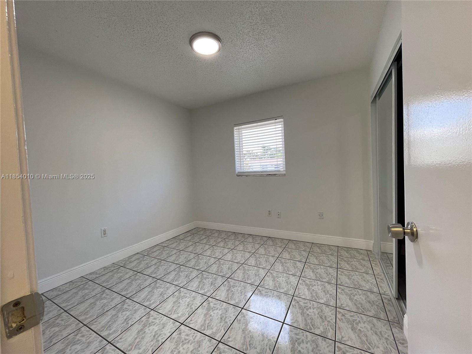15550 Southwest 308th Street, Unit 15550 Homestead, FL 33033 - Photo 8 of 11 a view of a room with a sink