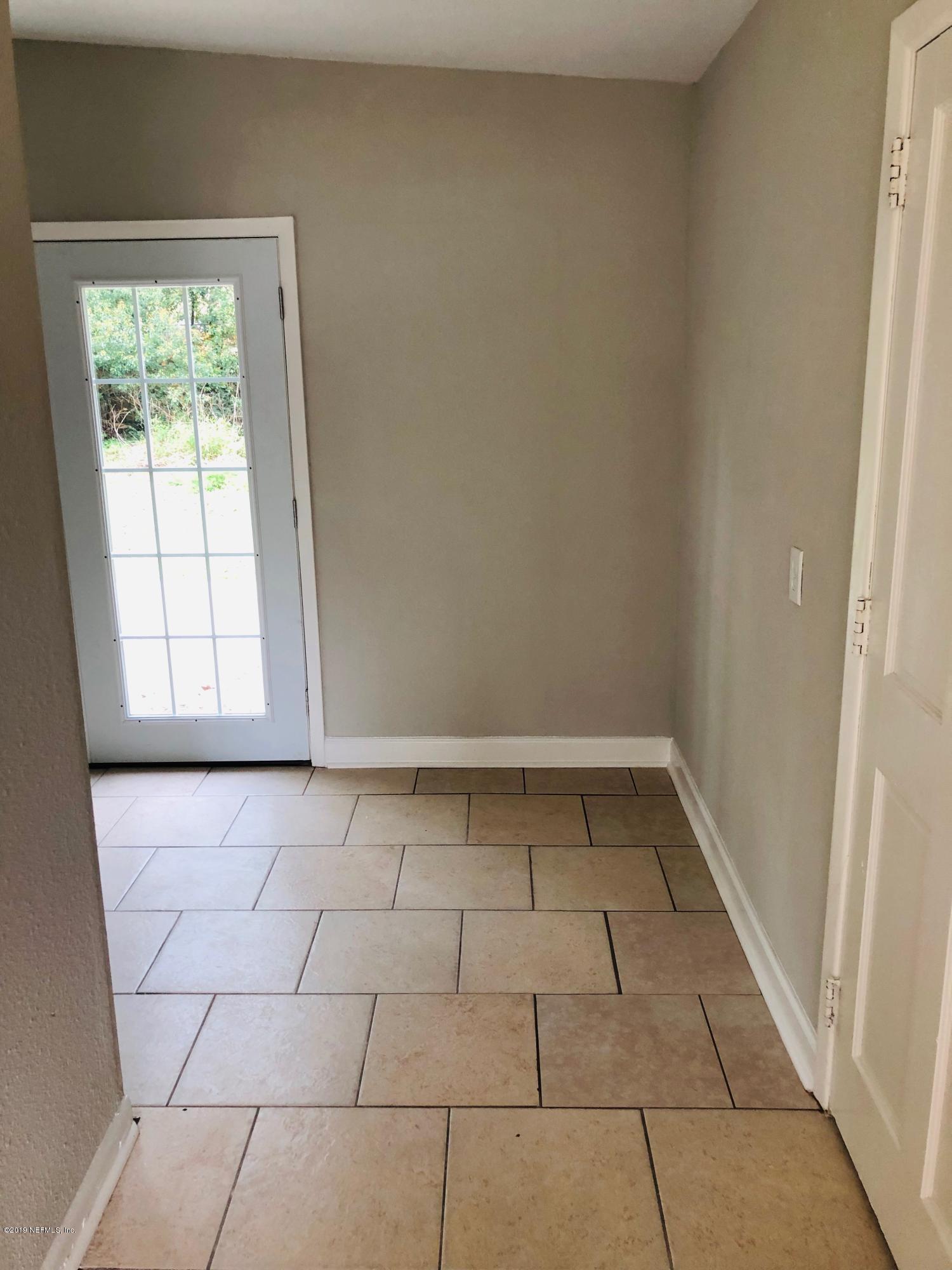 10448 Dodd Road Jacksonville, FL 32218 - Photo 5 of 14 a view of utility room and window