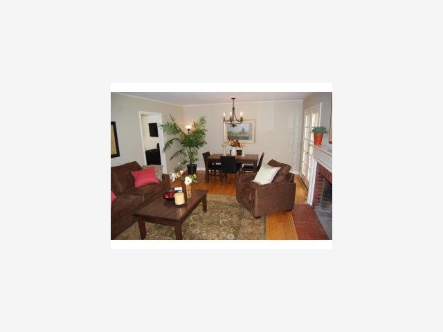 1124 Springer Road Los Altos, CA 94024 - Photo 3 of 9 a living room with furniture and a potted plant