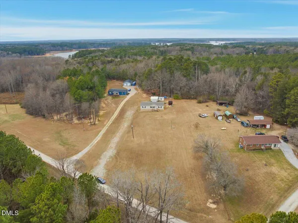 a spacious bedroom with a bed and a chandelier