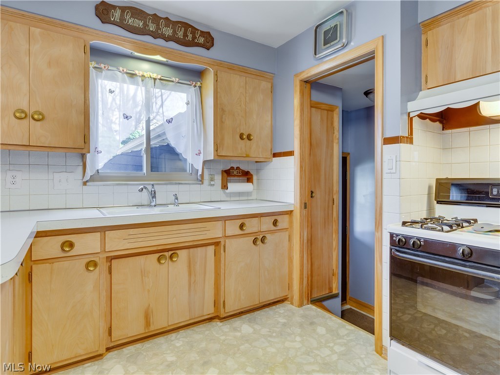 7189 Maplewood Road Parma, OH 44130 - Photo 7 of 20 Kitchen boasts lots of cabinets, counter space and pantry.