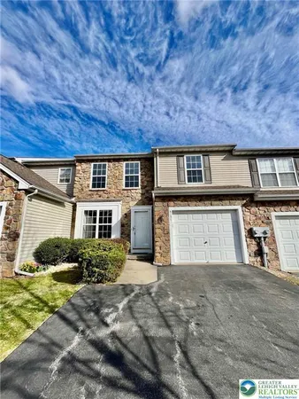 front view of a house with a street