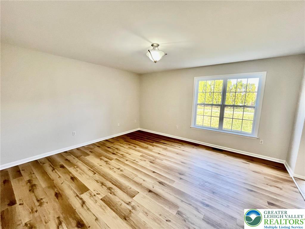 4131 Walter Road Bethlehem, PA 18020 - Photo 2 of 13 wooden floor in an empty room with a window