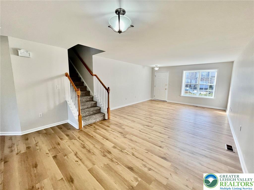 4131 Walter Road Bethlehem, PA 18020 - Photo 4 of 13 wooden floor in an empty room with a window