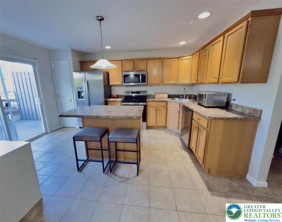 4131 Walter Road Bethlehem, PA 18020 - Photo 5 of 13 a kitchen with a sink a counter top space appliances and cabinets