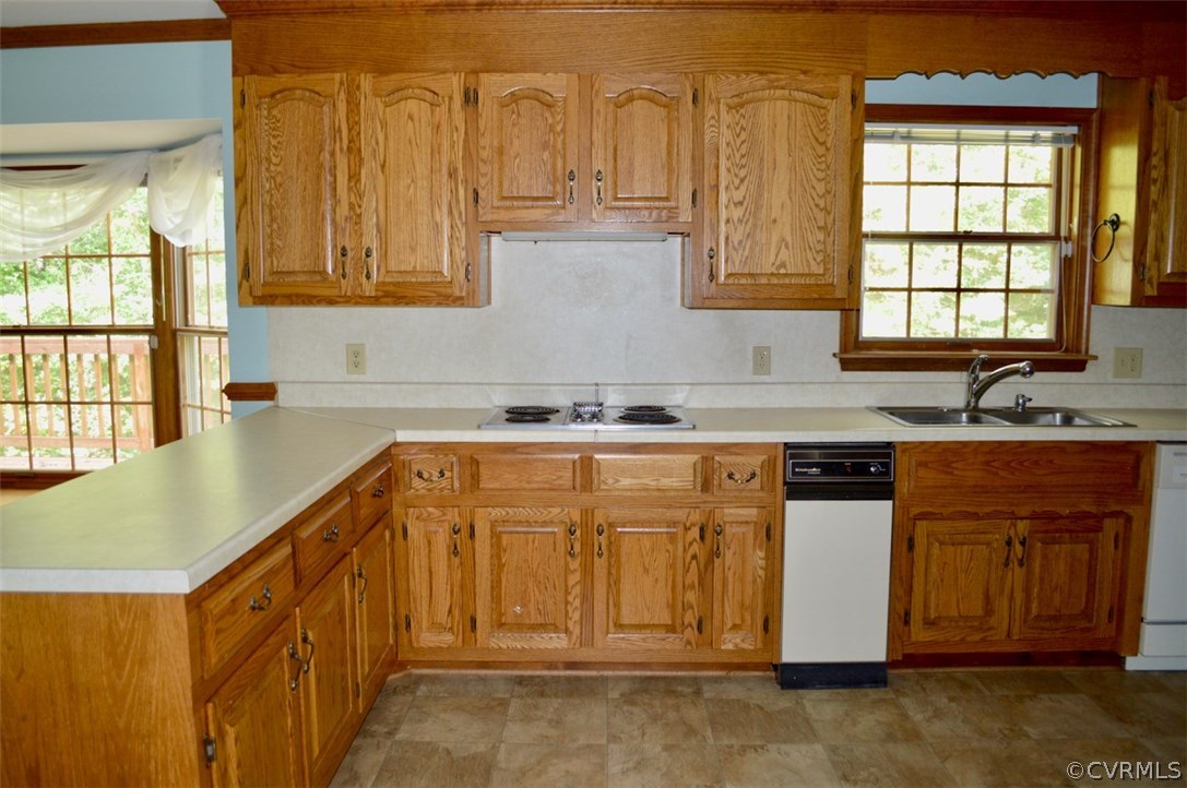 5900 Deep Forest Road Chester, VA 23831 - Photo 8 of 29 a kitchen with stainless steel appliances granite countertop a sink and cabinets