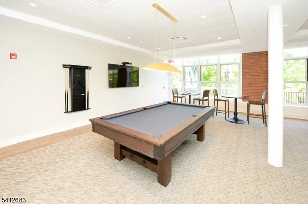 a living room with game table
