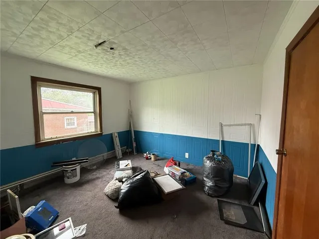 a room with furniture and a window