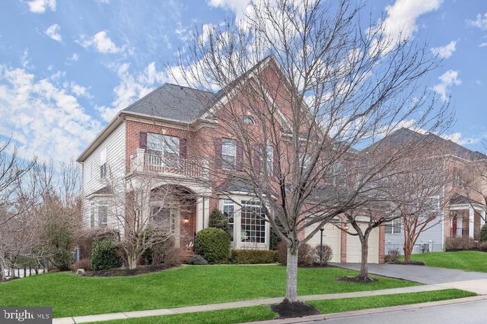 2520 Stone Cliff Drive Baltimore, MD 21209 - Photo 1 of 72 a view of a white house next to a yard with big trees