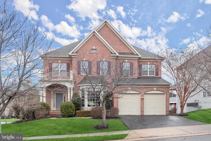 2520 Stone Cliff Drive Baltimore, MD 21209 - Photo 2 of 72 a front view of a house with a yard