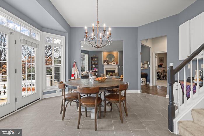 2520 Stone Cliff Drive Baltimore, MD 21209 - Photo 30 of 72 a view of a dining room with furniture window and wooden floor