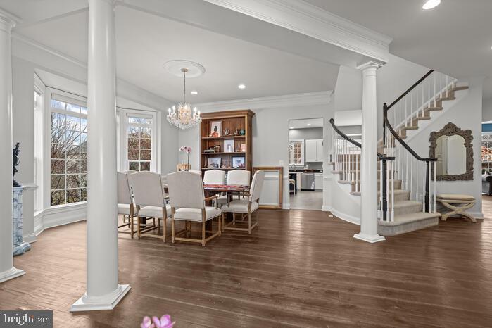 2520 Stone Cliff Drive Baltimore, MD 21209 - Photo 32 of 72 a living room with furniture and wooden floor next to a large window
