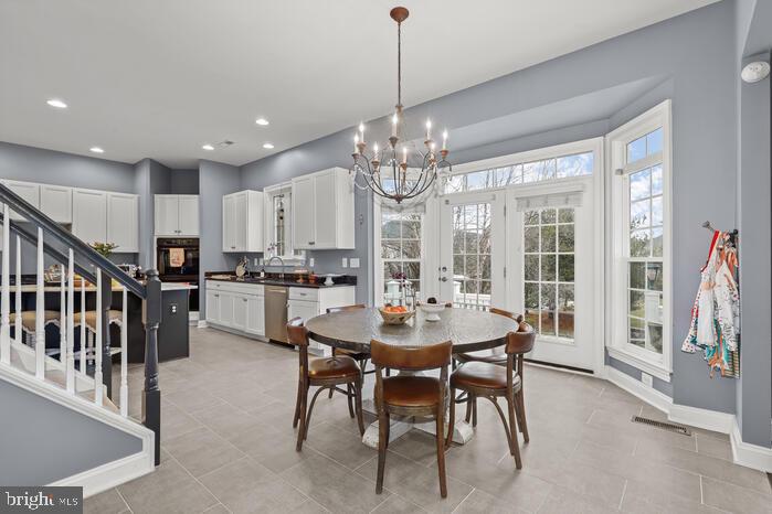 2520 Stone Cliff Drive Baltimore, MD 21209 - Photo 33 of 72 a view of a dining room with furniture window and wooden floor
