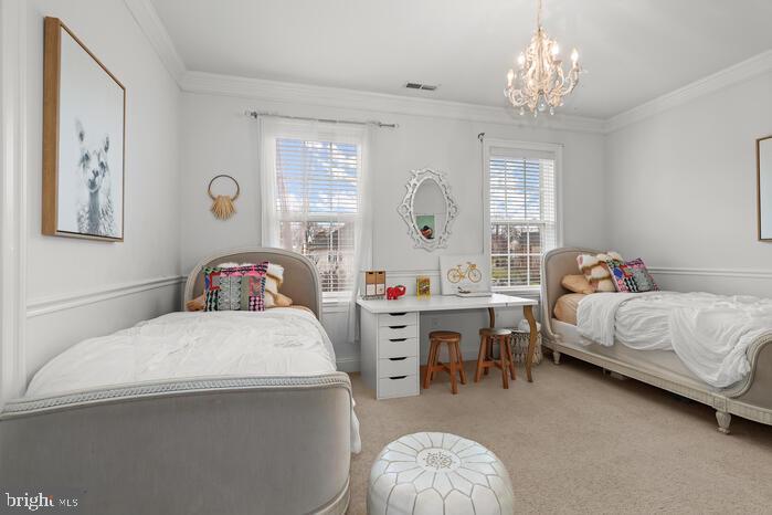 2520 Stone Cliff Drive Baltimore, MD 21209 - Photo 39 of 72 a bedroom with a bed and a chandelier