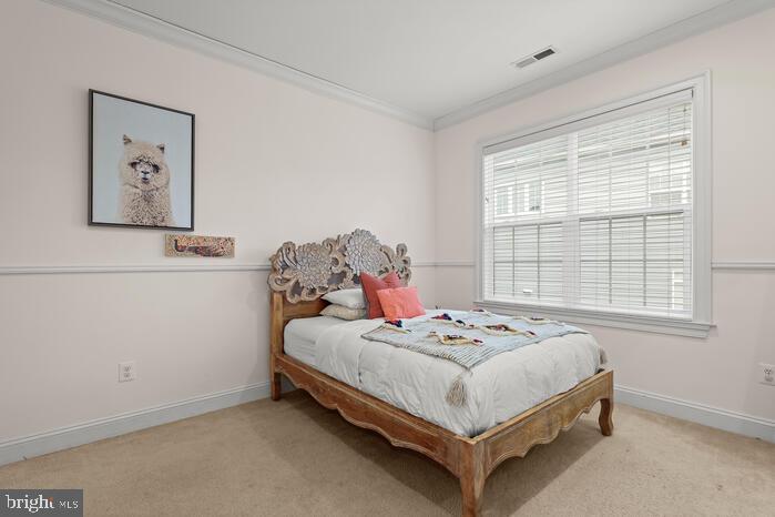 2520 Stone Cliff Drive Baltimore, MD 21209 - Photo 46 of 72 a bed sitting in a bedroom next to a window