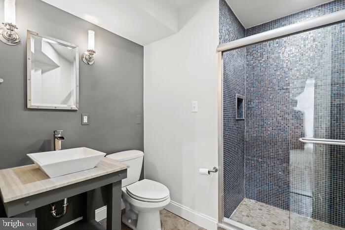 2520 Stone Cliff Drive Baltimore, MD 21209 - Photo 49 of 72 a bathroom with a sink toilet and shower