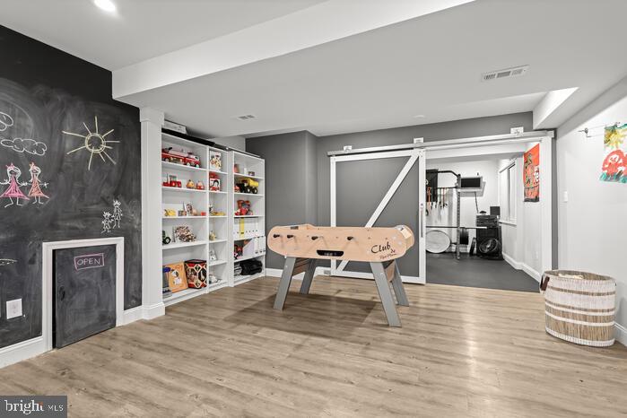 2520 Stone Cliff Drive Baltimore, MD 21209 - Photo 55 of 72 a living room with furniture and a wooden floor