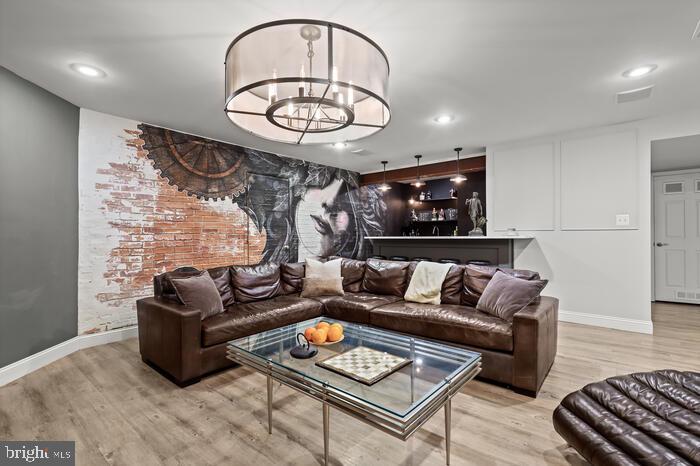 2520 Stone Cliff Drive Baltimore, MD 21209 - Photo 59 of 72 a living room with furniture and a wooden floor