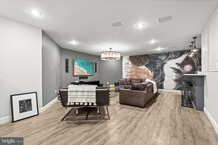 2520 Stone Cliff Drive Baltimore, MD 21209 - Photo 60 of 72 a living room with furniture and a wooden floor