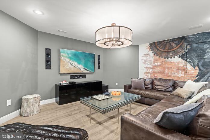 2520 Stone Cliff Drive Baltimore, MD 21209 - Photo 62 of 72 a living room with furniture and a flat screen tv