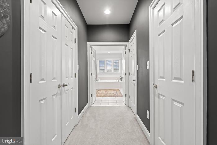 2520 Stone Cliff Drive Baltimore, MD 21209 - Photo 69 of 72 a view of a hallway with wooden floor and closet area