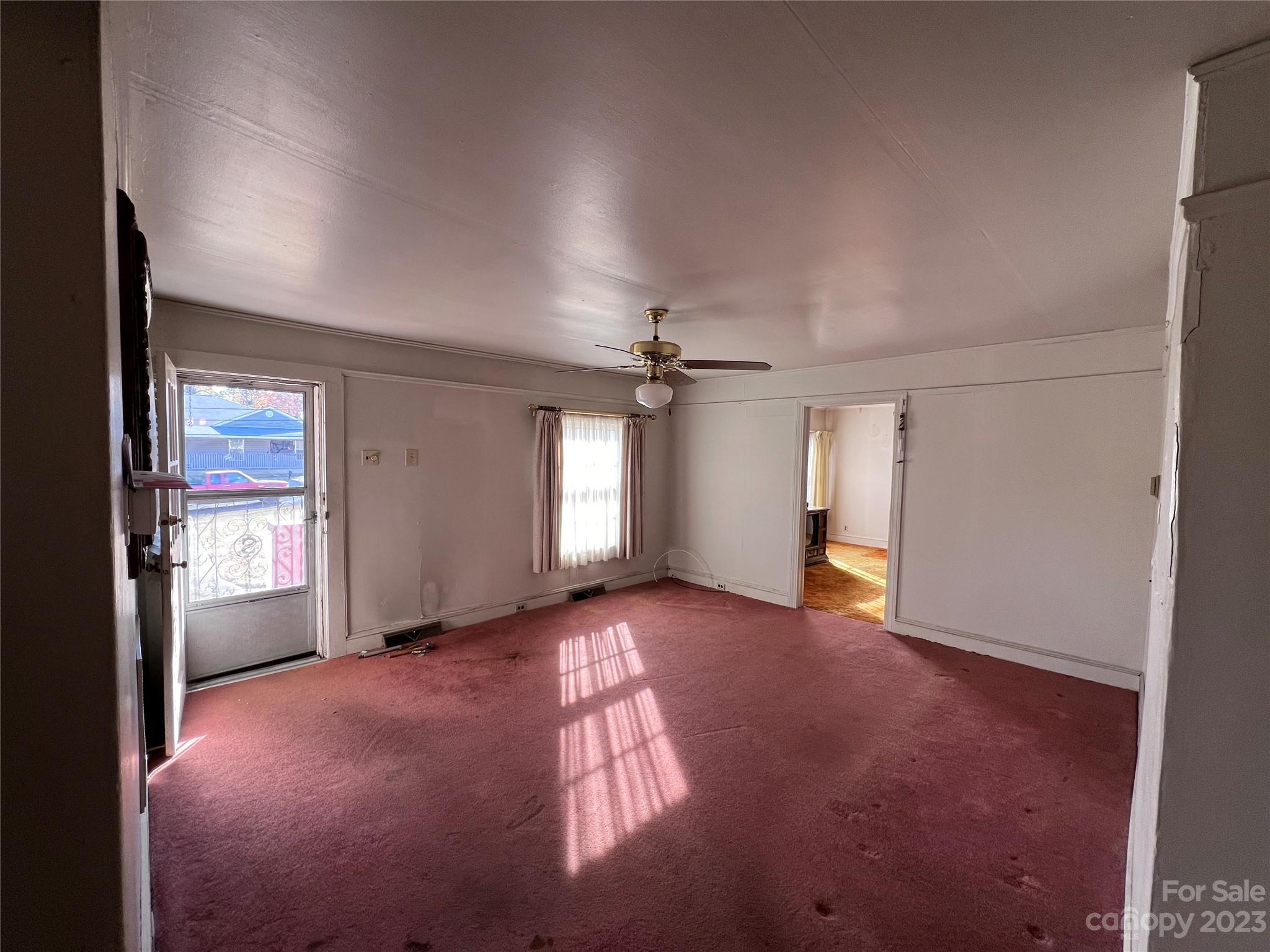 127 River Loop Road Belmont, NC 28012 - Photo 11 of 34 an empty room with windows and cabinet