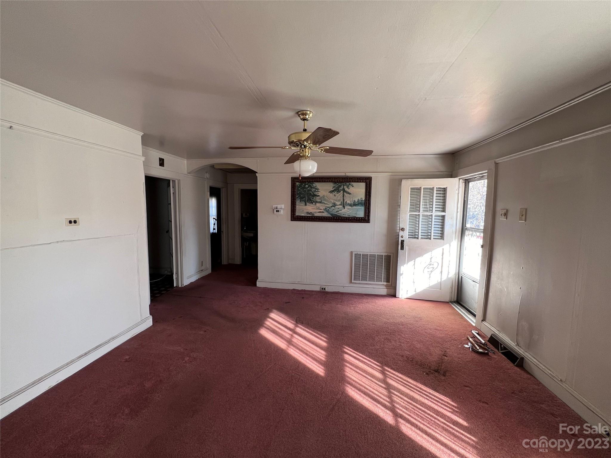 127 River Loop Road Belmont, NC 28012 - Photo 12 of 34 a spacious bedroom with a large bed and a chandelier