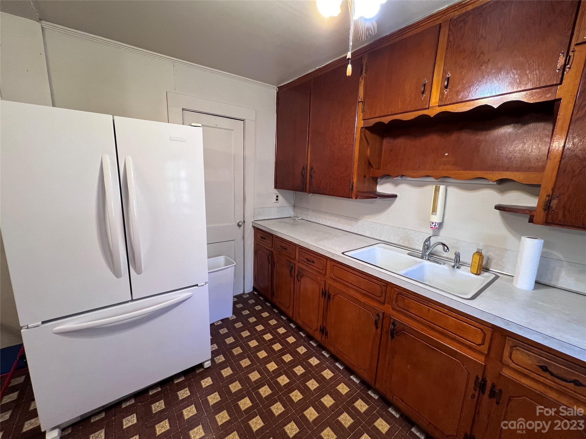 127 River Loop Road Belmont, NC 28012 - Photo 26 of 34 a kitchen with stainless steel appliances a refrigerator and a stove