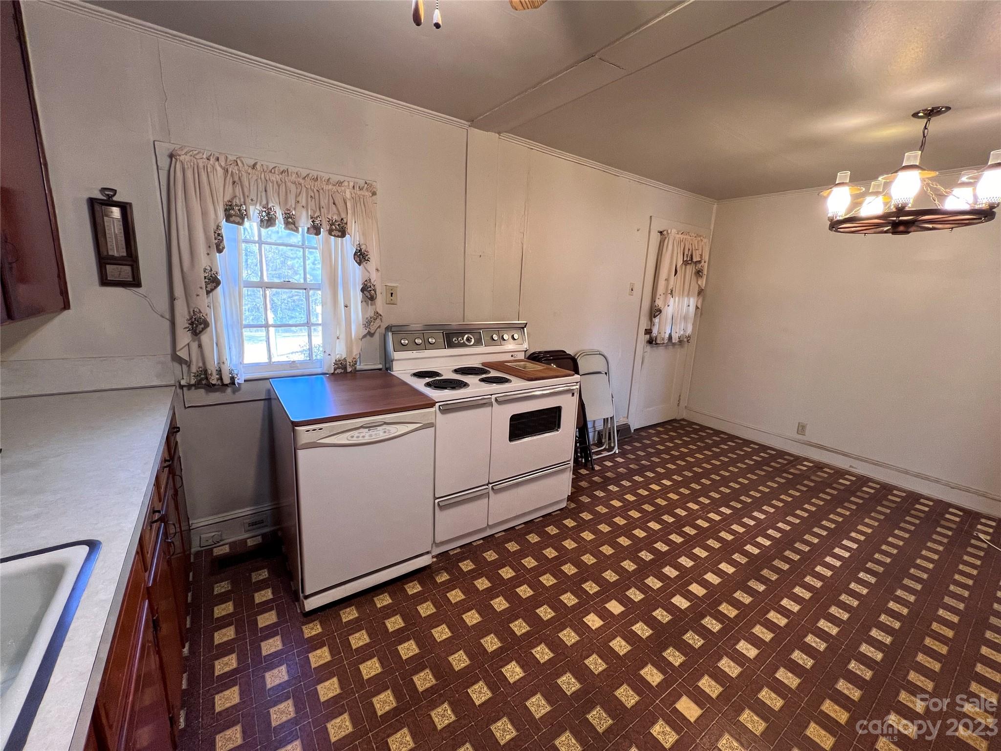 127 River Loop Road Belmont, NC 28012 - Photo 27 of 34 a kitchen with a sink a stove and cabinets