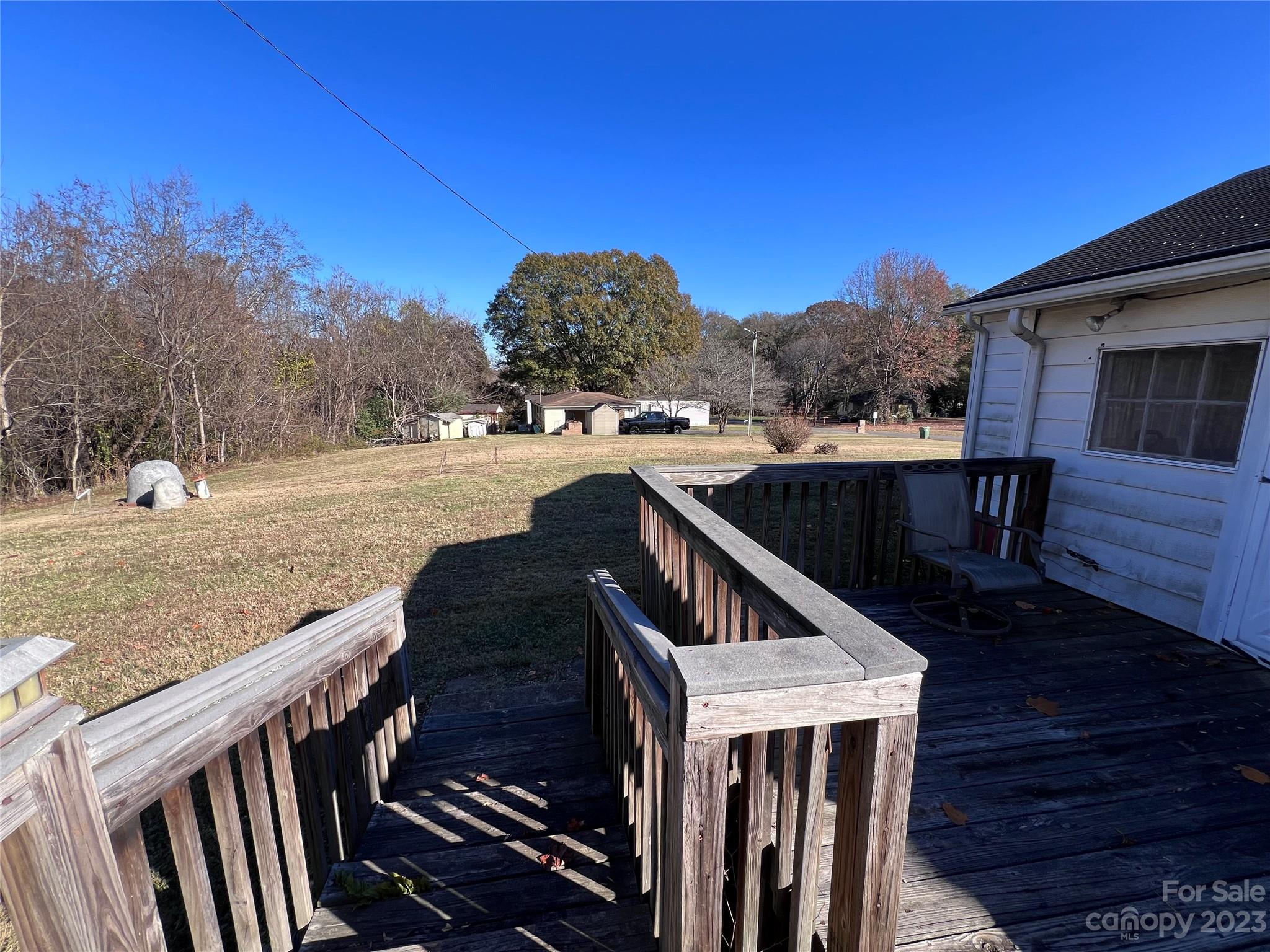 127 River Loop Road Belmont, NC 28012 - Photo 31 of 34 a view of a house with backyard and trees
