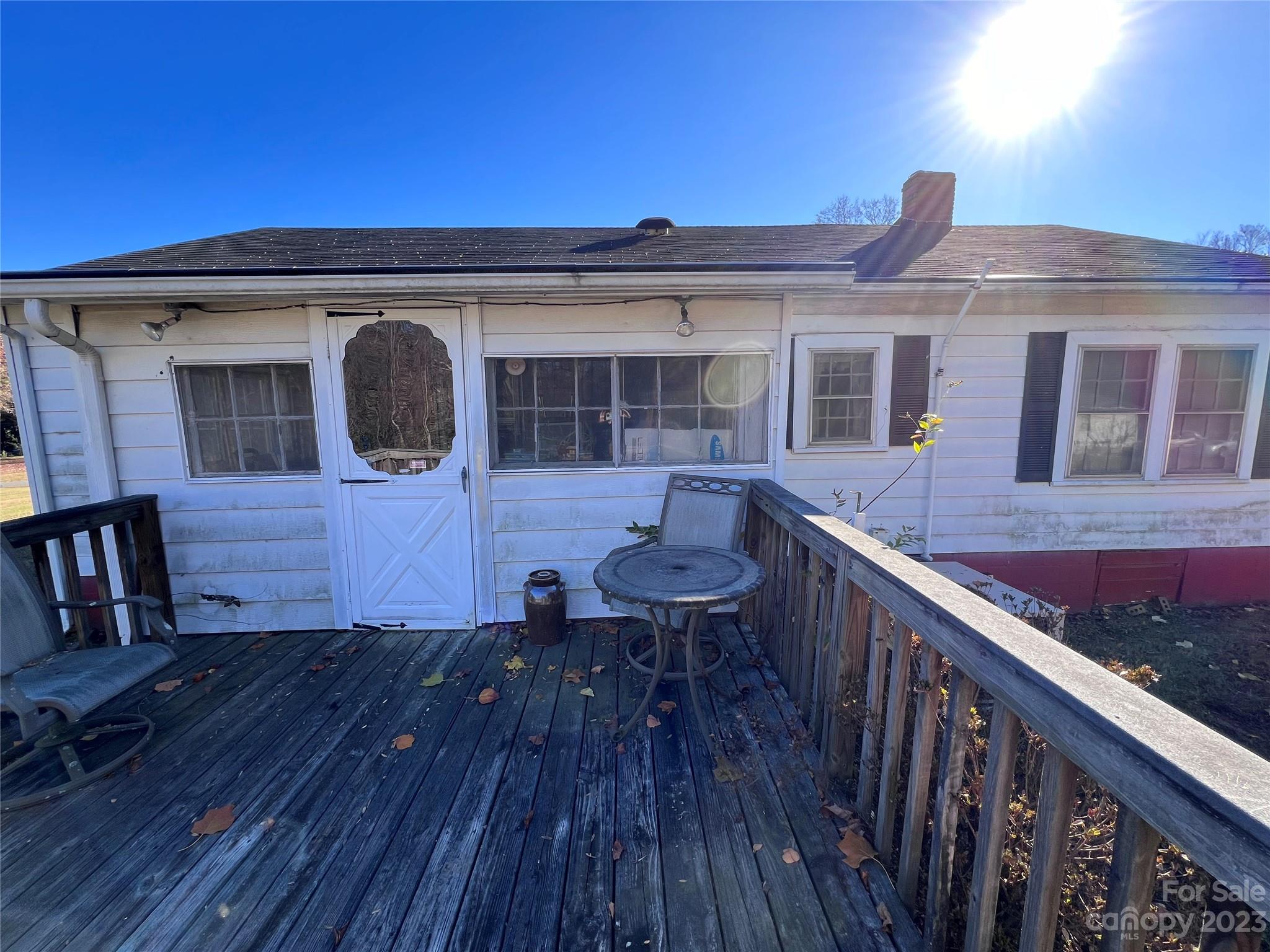 127 River Loop Road Belmont, NC 28012 - Photo 33 of 34 a view of a house with wooden deck and furniture