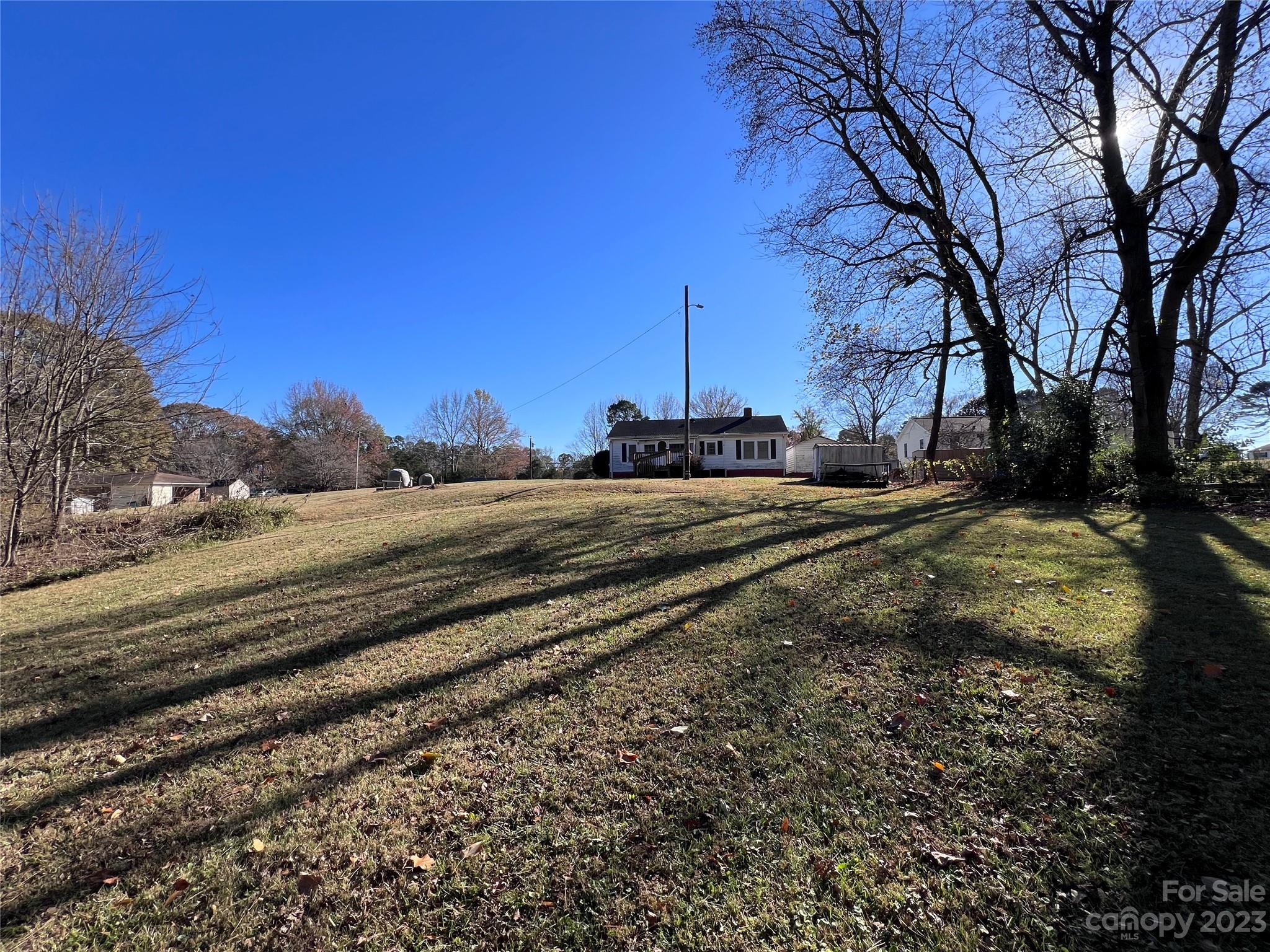 127 River Loop Road Belmont, NC 28012 - Photo 34 of 34 a view of a yard with car parked