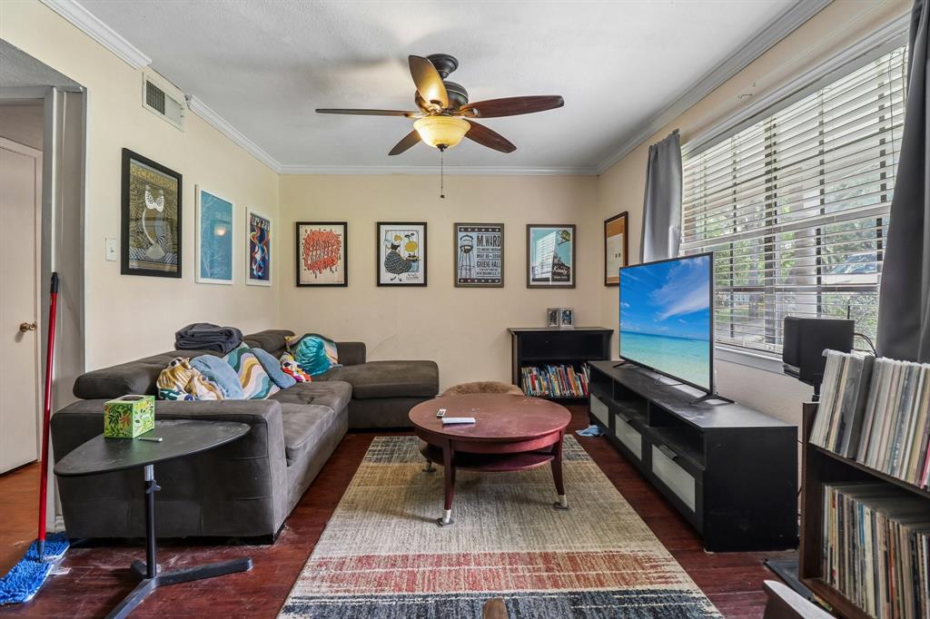 820 North Bowen Road Arlington, TX 76012 - Photo 12 of 40 a living room with furniture a window and a flat screen tv