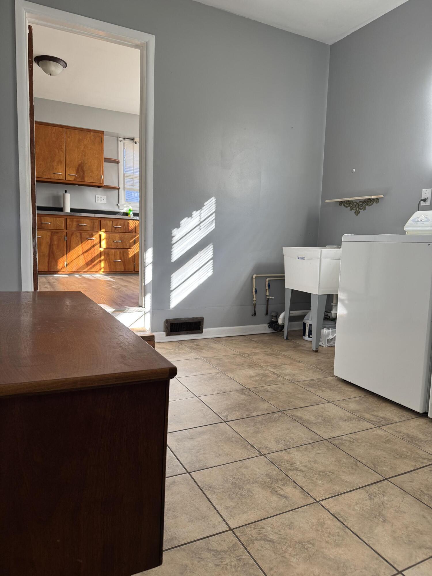 111 West Rutsen Street Rensselaer, IN 47978 - Photo 11 of 21 a room with a table and a window